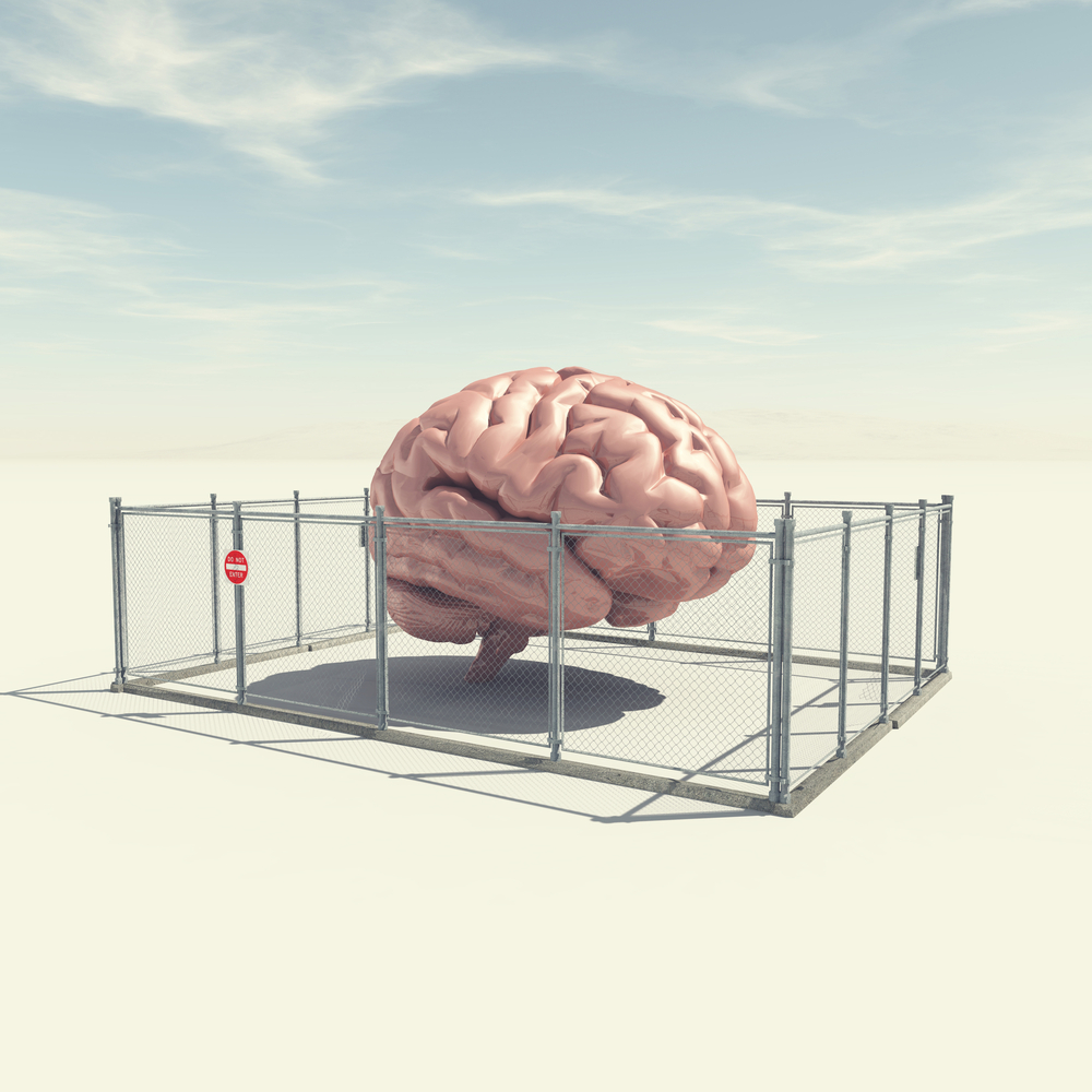 concept image of a brain enclosed in a protective fence