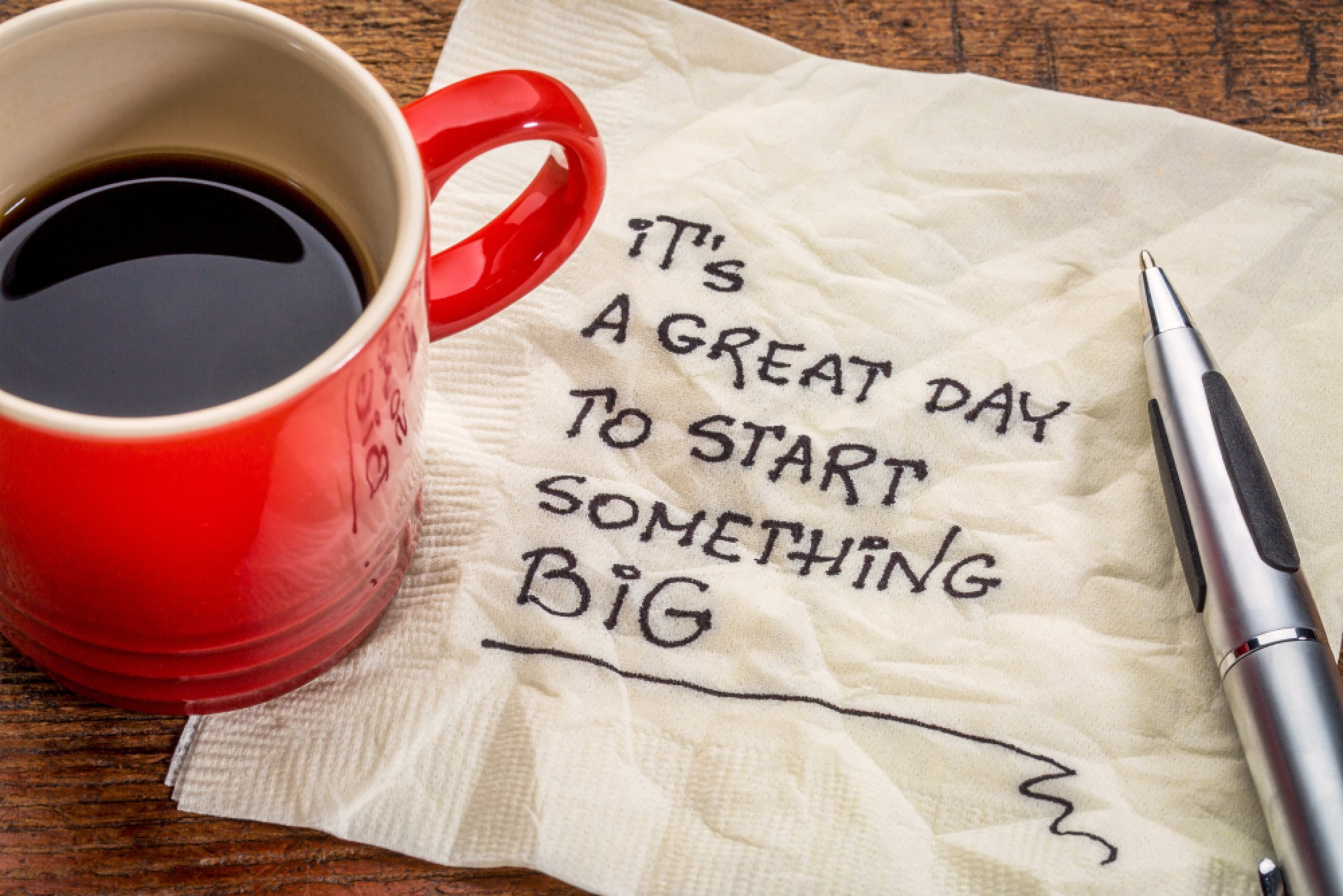 Napkin with "It's a great day to start something BIG" written on it