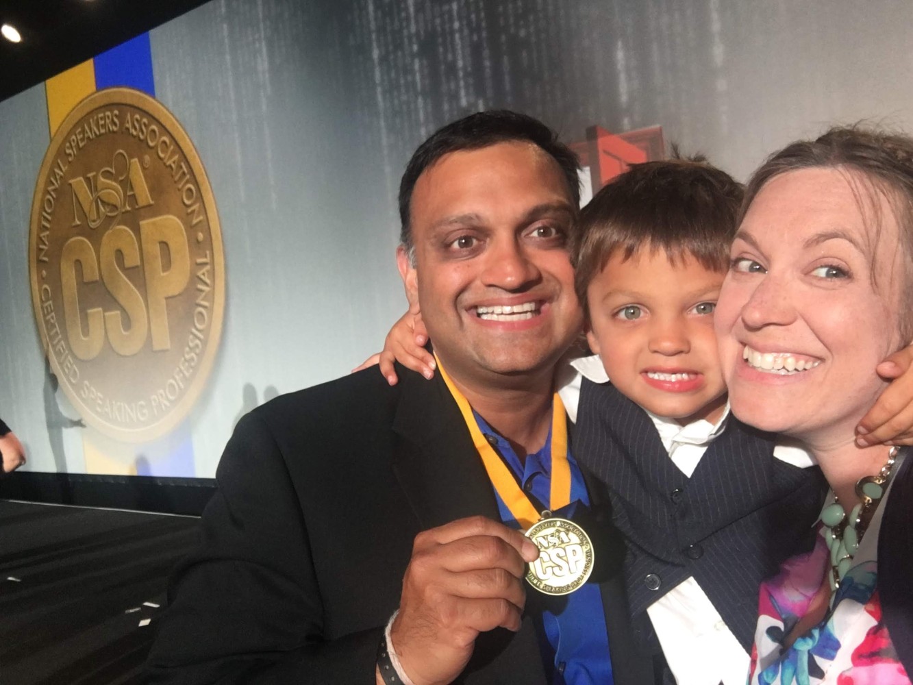 A candid image of Avish, his son, & his wife at the CSP award ceremony